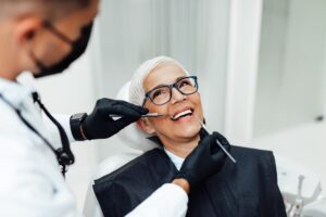 Dentist consulting a patient about early signs of gum disease